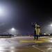 Ypsilanti resident Ndongo Ndaw carries a blanket and checks his phone in the Best Buy parking lot Wednesday night. Daniel Brenner I AnnArbor.com